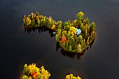 Canada, province of Quebec, Mauricie region, flight with Hydravion Adventure in the Indian summer period, island and cottage (aerial view)