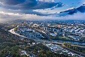 France, Isere, Grenoble city, Bastille, Isère river, Drac river, Chartreuse, Vercors and Belledonne mountains at the back (aerial shot)