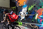 Canada, province of Quebec, Montreal, the Plateau-Mont-Royal district, mural and deliverer of ready meals