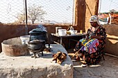 Namibia, Kunene province, Kamanjab, a Damara woman in her kitchen