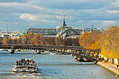 France, Paris, area listed as World Heritage by UNESCO, the banks of Seine river the quays of the Louvre in autumn, the Grand Palais and the bridge Leopold Sedar Senghor