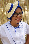 Spain, Canary Islands, Tenerife Island, young woman in traditional Canarian clothes during a romería, a village festival