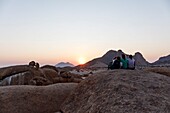 Namibia, Erongo province, Spitzkoppe, tourists watching the sunset