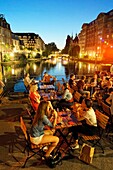 France, Bas-Rhin, Strasbourg, old town listed as World Heritage by UNESCO, cafes boats on the Quai des Bateliers on the banks of the Ill river