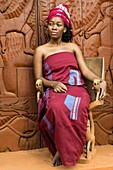 Benin, Abomey, woman in front of the door of Abomey museum