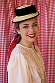 Spain, Canary Islands, Tenerife Island, young woman in traditional Canarian clothes during a romería, a village festival