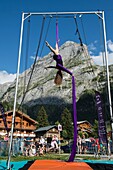 France, Savoie, mountain of Vanoise, Pralognan la Vanoise, woman in demonstration of aerobatics on rope