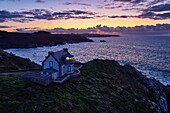 France, Finistere, Bay of Douarnenez, Cap Sizun, Pointe du Millier, The Millier lighthouse at dusk, Great National Location (aerial view)