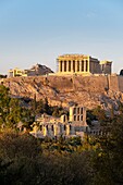 Greece, Athens, Acropolis of Athens, a UNESCO World Heritage Site, seen from the Hill of the Muses or Philopappos Hill, the Parthenon and the Odeon of Herodes Atticus