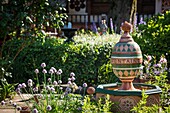 France, Haute Savoie, Rumilly, Vaulx, secret gardens, remarkable garden label, the Melina fountain in painted lime mortar