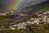 Spain, Canary Islands, Gran Canaria Island, Tejeda, high angle village view with rainbow