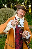 France, Yvelines (78), les Mesnuls, Les Mesnuls castlle,Heritage Day 2019, man in costume loading his gun before a duel during a historical reconstruction