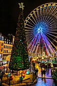 France, Nord, Lille, the Ferris wheel and Christmas lights on the Place du General de Gaulle