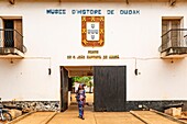 Benin, Abomey, woman in front of the door of Ouidah museum