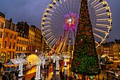 France, Nord, Lille, the Ferris wheel and Christmas lights on the Place du General de Gaulle