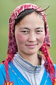 Kyrgyzstan, Naryn Province, Son-Kol Lake, altitude 3000m, portrait of a Kyrgyz girl wearing a headscarf