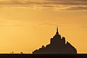 France, Manche (50), Mont Saint-Michel Bay listed as World Heritage by UNESCO, Abbey of Mont Saint-Michel at sunset