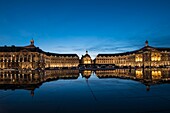 France, Gironde, Bordeaux, the Place de la Bourse at dusk and its reflection in the largest water mirror in the world with 3450 m²