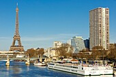 France, Paris, the riverbanks of the Seine river listed as World Heritage by UNESCO, facades of apartment buildings in Beaugrenelle district, Rouelle and Bir Hakeim bridges and Eiffel tower