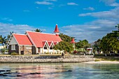 Mauritius, Rivière du Rempart district, Cap Malheureux, Notre-Dame Auxiliatrice church with its red roof emblematic of the island