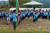 Papua New Guinea, Simbu Province, Kagaï village, daily raising flag ceremony when the students sing the national anthem