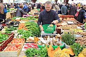 France, Correze, Brive la Gaillarde, Halle Georges Brassens, market, fruit and vegetable vendor