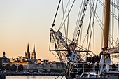 France, Gironde, Bordeaux, area listed as World Heritage by UNESCO, three-masted schooner the Pelican of London moored at Quai Richelieu, in the background the towers of the Saint-Louis des Chartrons church