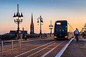 France, Gironde, Bordeaux, area listed as World Heritage by UNESCO, the Pont de Pierre over the Garonne, at the bottom the spire and the Saint-Michel Basilica in Bordeaux