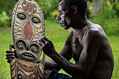 Papua New Guinea, East Sepik Province, Sepik River Region, Kanganamun Village, House of Spirits (Haustambaran), carver