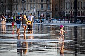 France, Gironde, Bordeaux, area classified as World Heritage by UNESCO, Saint-Pierre district, Place de la Bourse, the reflecting pool dating from 2006 and made by the fountain maker Jean-Max Llorca