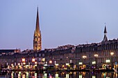 France, Gironde, Bordeaux, area listed as World Heritage by UNESCO, Saint-Pierre district, Place de la Bourse, the reflecting pool, in the background the spire of the Saint-Michel Basilica in Bordeaux