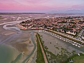 France, Somme, Baie de Somme, Le Crotoy, Sunrise over the Crotoy and the Baie de Somme at low tide (aerial view)