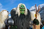 Switzerland, Valais, Lotschental valley, Wiler, Tschaggatta Carnival, costumes are made from animal skins, wooden masks and horse hair