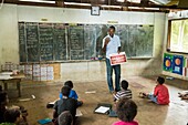 Papua New Guinea, East Sepik Province, Sepik River Region, Samban village school, Dr. Karue gives information on dental hygiene