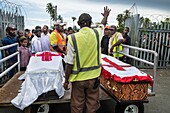 Papua New Guinea, East Sepik Province, Sepik River Region, Wewak city, coffins handed over to families at Wewak airport