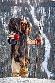 Switzerland, Valais, Lotschental valley, Wiler, Tschaggatta Carnival, costumes are made from animal skins, wooden masks and horse hair