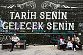 Turkey, Istanbul, Karakoy area, on the wall: history belongs to you, futur belongs to you