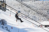 France, Pyrenees Atlantiques, Gourette ski resort (locality of the commune of Eaux-Bonnes), intervention of a maintenance agent on a cable car