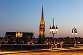 France, Gironde, Bordeaux, area listed as World Heritage by UNESCO, the Pont de Pierre over the Garonne, at the bottom the spire and the Saint-Michel Basilica in Bordeaux