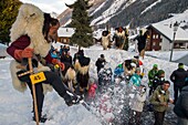 Switzerland, Valais, Lotschental valley, Wiler, Tschaggatta Carnival, costumes are made from animal skins, wooden masks and horse hair