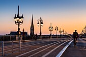 France, Gironde, Bordeaux, area listed as World Heritage by UNESCO, the Pont de Pierre over the Garonne, at the bottom the spire and the Saint-Michel Basilica in Bordeaux