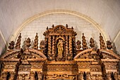 France, Lot et Garonne, Fongrave, Saint-Léger church, detail of the carved wooden altarpiece of the high altar dedicated to Our Lady of the Nativity (1645 - 1650), at top is the Virgin and Child standing surrounded by garlands of flowers and fruits