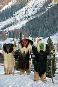 Switzerland, Valais, Lotschental valley, Wiler, Tschaggatta Carnival, costumes are made from animal skins, wooden masks and horse hair