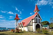 Mauritius, Rivière du Rempart district, Cap Malheureux, Notre-Dame Auxiliatrice church with its red roof emblematic of the island