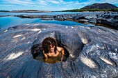 Colombia, Vichada, Puerto Carreno, Ventana Reserve on the Orenoco river, walk on the submerged rocks and swim in water holes