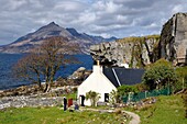 United Kingdom, Scotland, Highlands, Hebrides, Isle of Skye, Elgol village on the shores of Loch Scavaig towards the end of the Strathaird peninsula and the Black Cuillin Mountains in the background