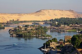 Egypt, Upper Egypt, Aswan, panorama of the Nile, its green islets and the high sand dunes bordering its left bank