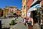 Italy, Liguria, Genoa, Boccadasse, small port and beach of Boccadasse, terrace of the cafe La Strambata in the port of Boccadasse