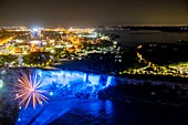 Canada, Ontario province, Niagara Falls, Night Horseshoe Falls lit up with fireworks