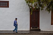 Spain, Canary Islands, Lanzarote Island, Biosphere Reserve, farmer in an alley of Teguise